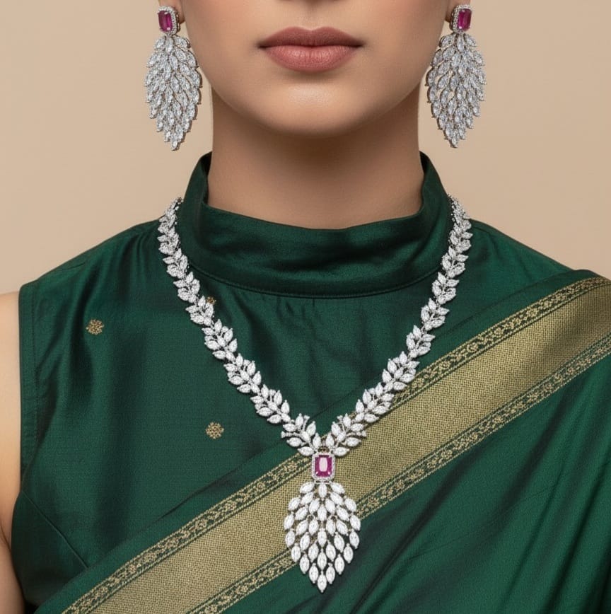 Woman wearing a green saree with a diamond necklace and earrings on a beige background