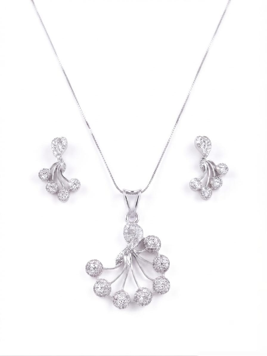Silver-tone jewelry set featuring a pendant necklace and matching stud earrings, both adorned with clear pavé gemstones in a fan-shaped cluster design, shown on a plain white background.